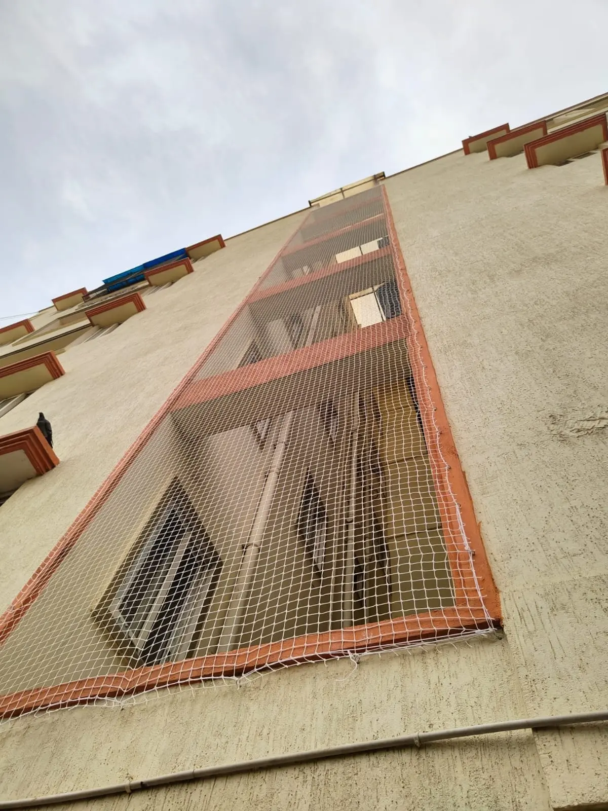 Deep ventilation duct shaft covered with strong safety nets preventing garbage piling and bird entry in luxury apartments - AJ Safe Net Solutions